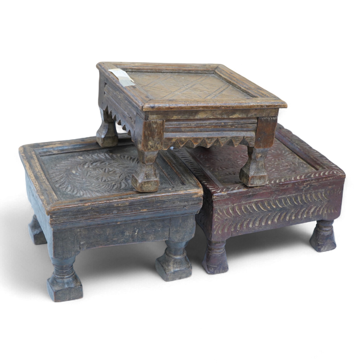 Three Indian carved wood stools or small tables, largest 27cm wide